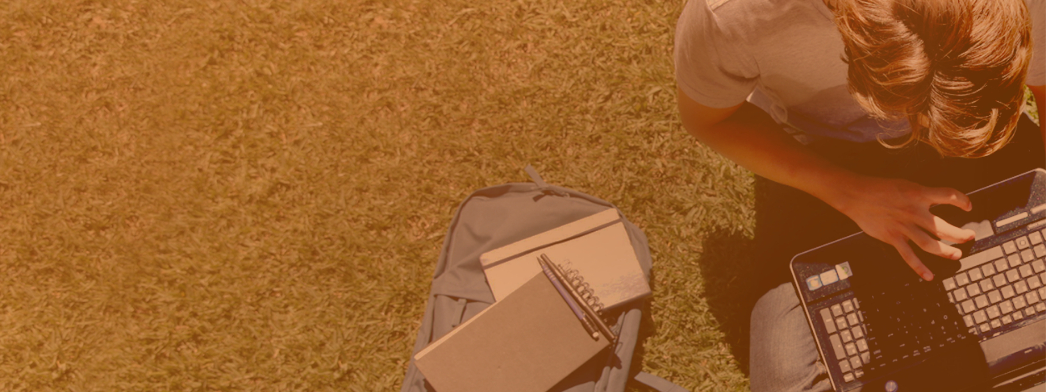 Man sitting on ground with laptop